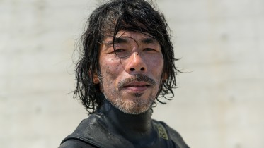 Japanese surfer in the contaminated area after the daiichi nuclear power plant irradiation, Fukushima prefecture, Tairatoyoma beach, Japan